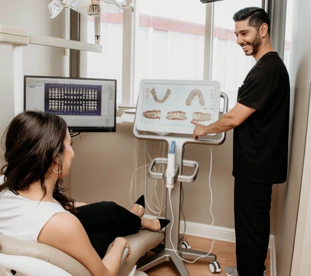 Dentist explaining a procedure to a patient