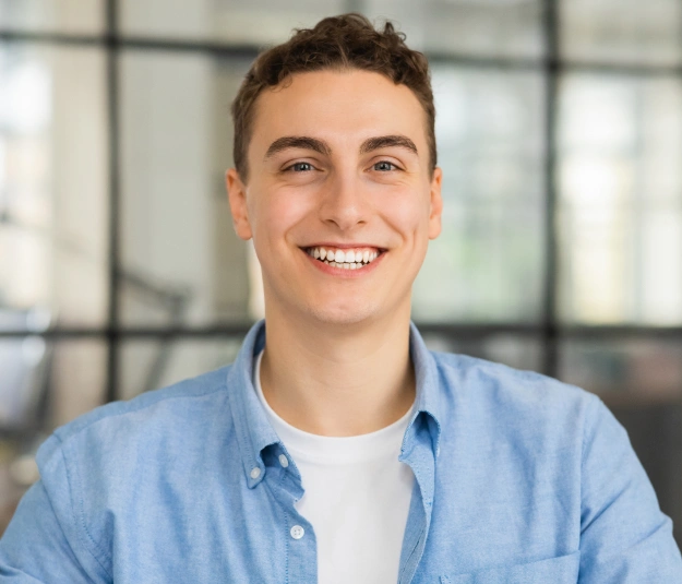 Smiling man in blue shirt